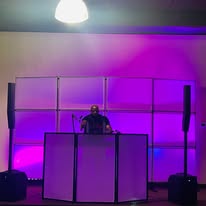 DJ setup with purple lighting at Phillips Event Center