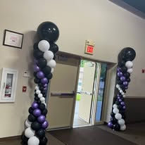 Balloon column decorations at venue entrance